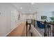 Hallway with neutral walls, carpet and wood and wrought iron railing overlooking staircase at 1219 Verdant Glade Pl, Winter Park, FL 32792