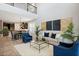 Bright living room adjacent to a dining area with modern light fixture and decor, and a view of the staircase at 1219 Verdant Glade Pl, Winter Park, FL 32792