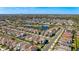 Aerial view of a large neighborhood near a lake surrounded by landscaping and roads at 1312 Blue Stem Ln, Winter Park, FL 32792
