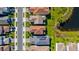 Aerial view of home, neighborhood streets, sidewalks, and nearby lake at 1312 Blue Stem Ln, Winter Park, FL 32792