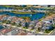An aerial view of the neighborhood's street, landscaping, and a large lake at 1312 Blue Stem Ln, Winter Park, FL 32792