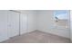 Bedroom with a window view and sliding closet doors at 1312 Blue Stem Ln, Winter Park, FL 32792