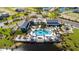 Aerial view of the community center featuring a pool, clubhouse, and playground at 1312 Blue Stem Ln, Winter Park, FL 32792