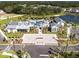 Aerial view of the community clubhouse, parking lot, and landscaped common areas at 1312 Blue Stem Ln, Winter Park, FL 32792