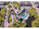 Aerial view of the community center with a pool, parking lot, and tropical landscaping at 1312 Blue Stem Ln, Winter Park, FL 32792