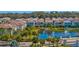 Beautiful community view overlooking a pond with fountain, lush landscaping, and tile roofs at 1312 Blue Stem Ln, Winter Park, FL 32792