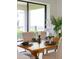 Elegant dining table is set with sophisticated tableware, candles, and an orchid centerpiece at 1312 Blue Stem Ln, Winter Park, FL 32792