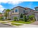 Charming two-story home with a two-car garage, paved driveway and landscaped front yard at 1312 Blue Stem Ln, Winter Park, FL 32792