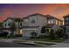 Charming two-story home with a gray exterior, two car garage, and well-maintained landscaping at 1312 Blue Stem Ln, Winter Park, FL 32792