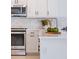 Close-up of a bright kitchen featuring modern stainless-steel appliances and stylish countertop decor at 1312 Blue Stem Ln, Winter Park, FL 32792
