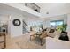 Spacious and bright living room with open floor plan, high ceilings, neutral decor, and access to dining area at 1312 Blue Stem Ln, Winter Park, FL 32792