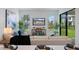 Inviting living room with a comfortable sofa, natural light, and a view to the outdoor area at 1312 Blue Stem Ln, Winter Park, FL 32792