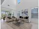 Bright, open living room featuring a dining area and large windows that provide plenty of natural light at 1312 Blue Stem Ln, Winter Park, FL 32792