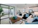 Open-concept living room and kitchen area with stainless appliances and sliding glass doors to patio at 1312 Blue Stem Ln, Winter Park, FL 32792