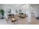 Open-concept living space with dining area and living room featuring modern decor and ample natural light at 1312 Blue Stem Ln, Winter Park, FL 32792