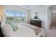 Serene bedroom with a large window, soft lighting, and calming color palette at 1312 Blue Stem Ln, Winter Park, FL 32792