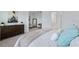 Spacious bedroom with a walk-in closet, dresser and cozy seating area at 1312 Blue Stem Ln, Winter Park, FL 32792