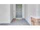 Close-up of a modern front door with a stone pillar and a tiled entryway at 142 Jones Fish Camp Rd, Edgewater, FL 32141