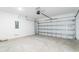 Spacious two-car garage with a concrete floor and white block walls at 142 Jones Fish Camp Rd, Edgewater, FL 32141