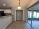 Dining room with tile floors and sliding glass doors at 1880 Olivia Cir, Apopka, FL 32703