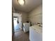 Laundry room with washer, dryer, and access to garage at 1880 Olivia Cir, Apopka, FL 32703