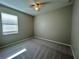 A standard-sized bedroom with a ceiling fan, carpet flooring, and a window at 2742 Carrickton Cir, Orlando, FL 32824