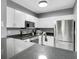 Modern kitchen with white cabinets, stainless steel appliances, and dark countertops at 304 E South St # 5029, Orlando, FL 32801