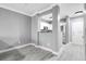 Open-concept living area offering views to the kitchen, white cabinets, and stainless steel appliances at 304 E South St # 5029, Orlando, FL 32801
