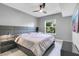 Main bedroom with gray walls, a king-size bed and an accent wall at 304 E South St # 5029, Orlando, FL 32801