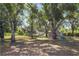 Very large backyard with mature trees, shed, hammock, and seating at 3871 Dallas Blvd, Orlando, FL 32833