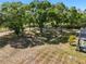 Overhead of a very large backyard with mature shade trees and a distant shed at 3871 Dallas Blvd, Orlando, FL 32833