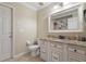 Clean bathroom featuring a granite countertop vanity with modern sink and fixtures, plus a neutral-toned color scheme at 3871 Dallas Blvd, Orlando, FL 32833