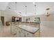 Open-concept kitchen with granite counters, stainless steel appliances, and center island perfect for entertaining guests at 3871 Dallas Blvd, Orlando, FL 32833