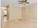 Light-filled room with neutral paint, unique ceiling fan, and tile flooring at 3871 Dallas Blvd, Orlando, FL 32833