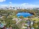 Aerial view of neighborhood near a lake and cityscape at 450 Cherokee Dr, Orlando, FL 32801
