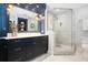 Elegant bathroom with a marble shower and dark blue vanity at 450 Cherokee Dr, Orlando, FL 32801