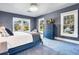 Bedroom with lake view and navy blue dresser at 450 Cherokee Dr, Orlando, FL 32801