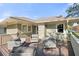 Outdoor deck with wicker furniture and view of the lake at 450 Cherokee Dr, Orlando, FL 32801