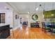 Open dining area with hardwood floors and a view to the kitchen at 450 Cherokee Dr, Orlando, FL 32801