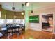 Bright dining area with banquette seating and view into living room at 450 Cherokee Dr, Orlando, FL 32801