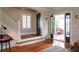 Elegant entryway with hardwood floors, staircase, and black front door at 450 Cherokee Dr, Orlando, FL 32801