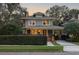 Charming two-story home with brick details and well-manicured landscaping at 450 Cherokee Dr, Orlando, FL 32801