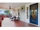 Inviting front porch with tiled flooring and comfortable seating at 450 Cherokee Dr, Orlando, FL 32801