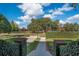 Landscaped walkway leading to the house with a view of a lake at 450 Cherokee Dr, Orlando, FL 32801