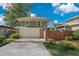 Two-car garage with brick wall and landscaping at 450 Cherokee Dr, Orlando, FL 32801