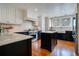 Modern kitchen with island, stainless steel appliances, and hardwood floors at 450 Cherokee Dr, Orlando, FL 32801