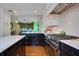 Spacious kitchen with marble countertops, stainless steel appliances, and adjacent dining area at 450 Cherokee Dr, Orlando, FL 32801