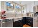 Modern kitchen with farmhouse sink, white countertops, and updated stainless steel appliances at 450 Cherokee Dr, Orlando, FL 32801
