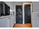Convenient laundry room with stacked washer and dryer at 450 Cherokee Dr, Orlando, FL 32801