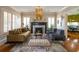 Mid-century modern living room with fireplace and stylish furniture at 450 Cherokee Dr, Orlando, FL 32801